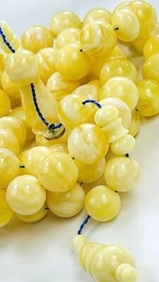 EXCLUSIVE ASSORTED ROYAL WHITE NATURAL BALTIC AMBER ROSARY 66 BEADS 65 GR. مسباح كهرمان جبسي بولندى حر فرز